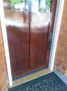 The "after" picture of a customer's front door finished by Palisades Painting Company. A Tail and One Door